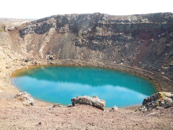 It's a bit of a challenge fitting such a large landform in the camera lens!  If you look to the far left edge along the middle, you might be able to see the park bench inside Kerið for scale.