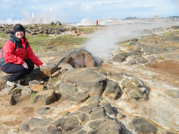 That's me, right next to one of the vents on this hydrothermal field.  Kids, do not try this at home!  Not only could the rocks be too hot to touch and burn your hand, the rocks you walk on could melt the soles of your hiking boots.