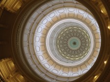 Looking up while inside, staring at a 8-foot wide star with the letters "T-E-X-A-S" on the points.