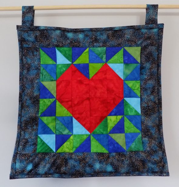Image of hanging quilt I HeART Earth Science