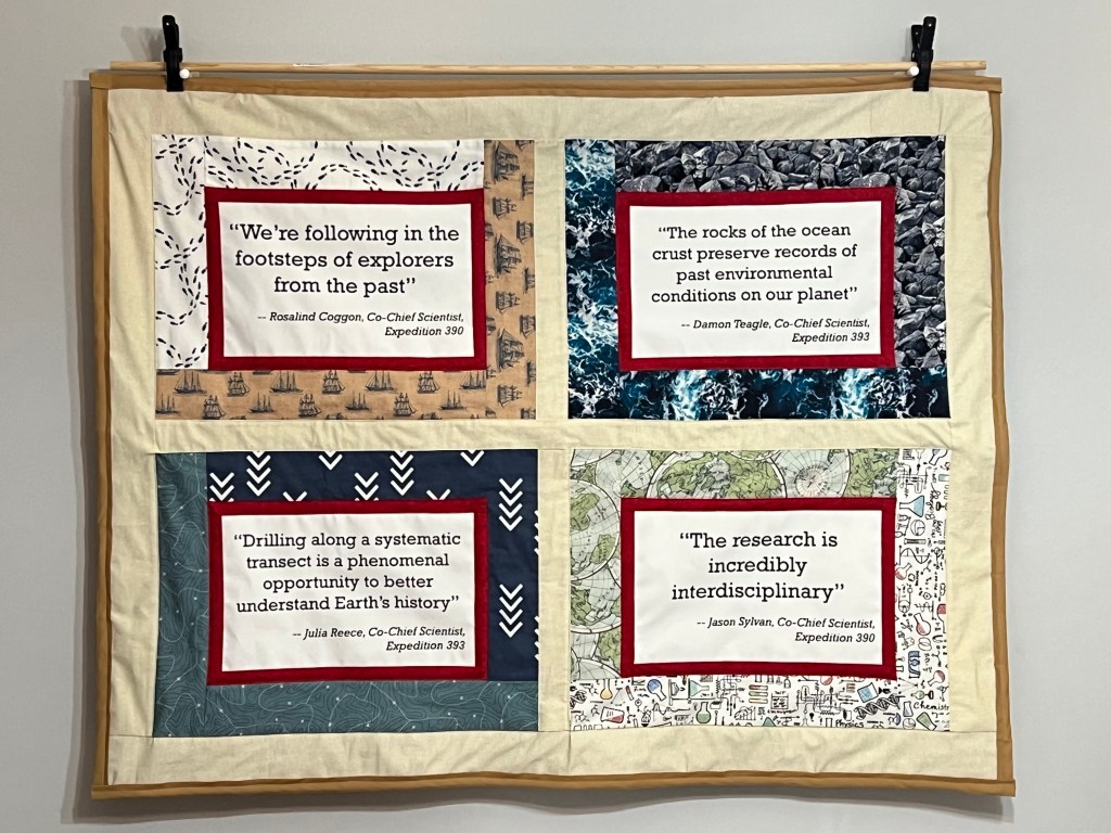 Photo of quilt hanging on a wall