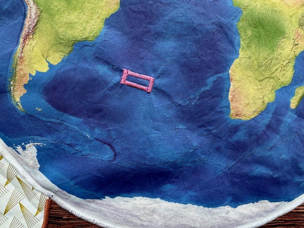 pink box in the middle of the South Atlantic Ocean on a globe