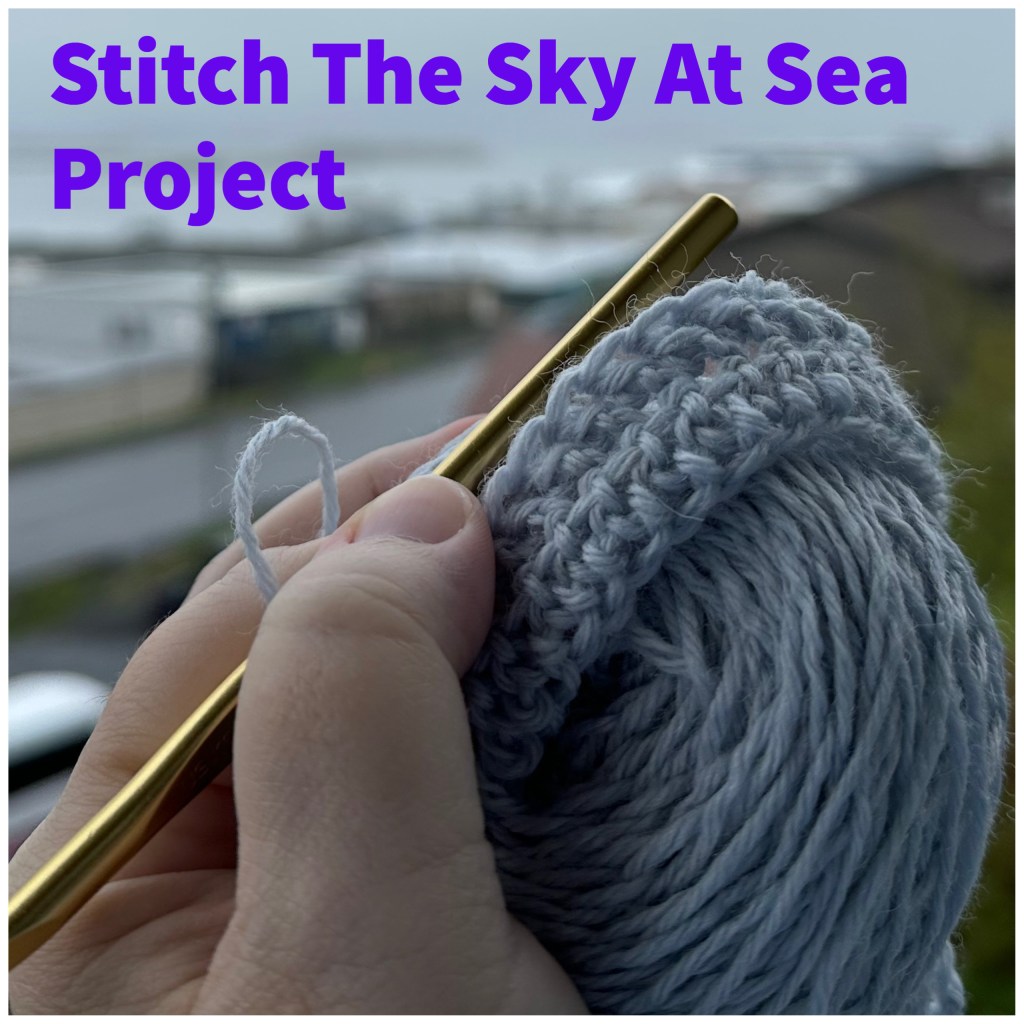 yarn and crochet hook being held with left hand, the words Stitch The Sky At Sea Project across the top