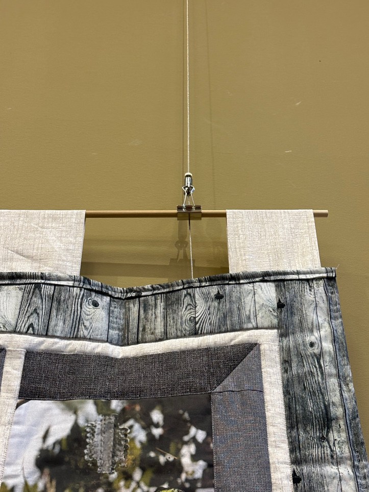 upper-right corner of a hanging quilt