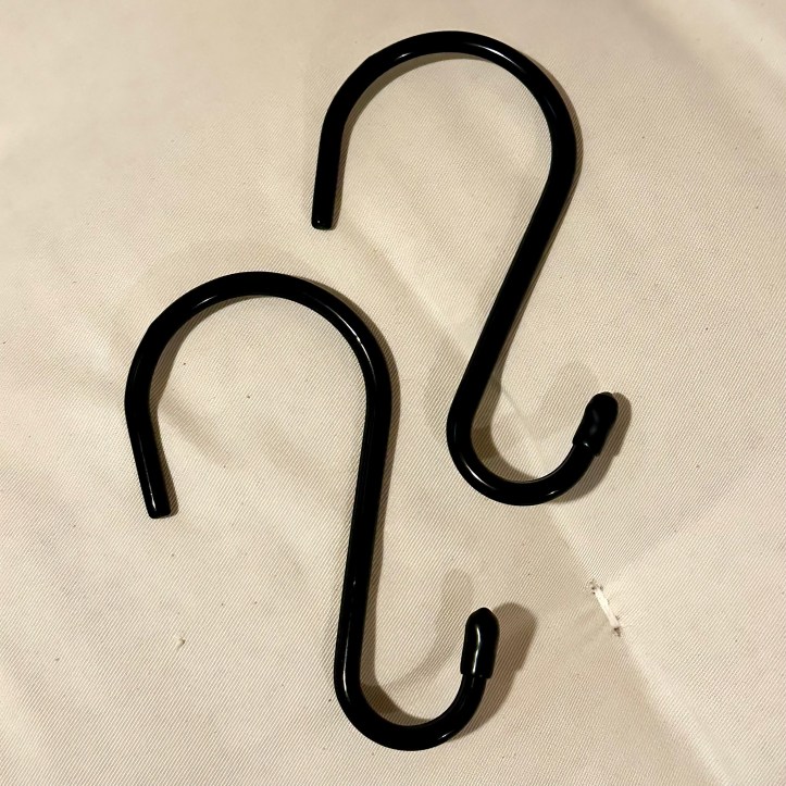 Two double-ended hooks on a sofa