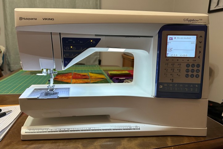 sewing machine at the end of a table