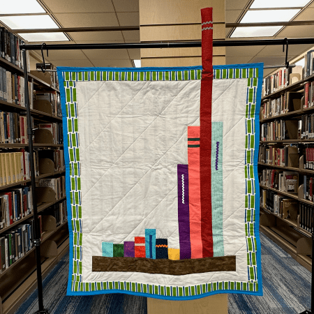 hanging quilt in a library