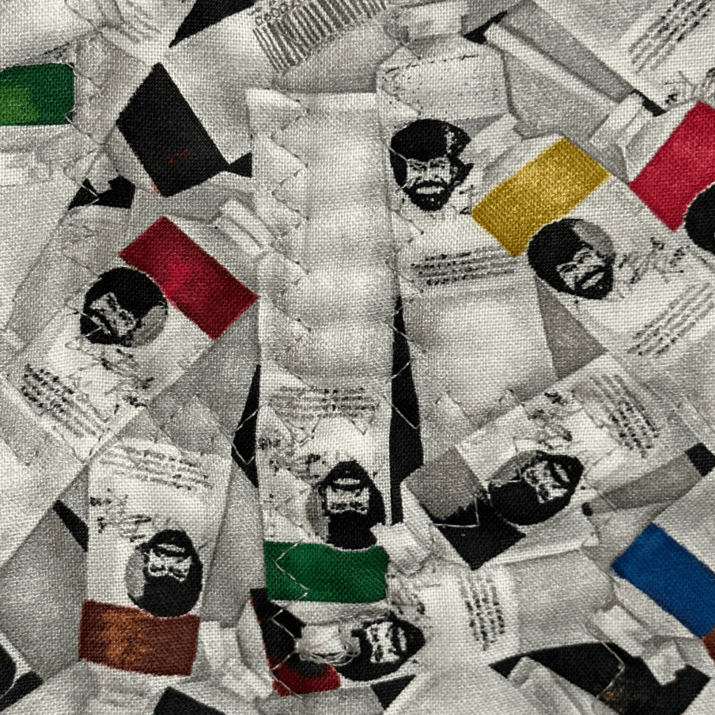 Paint tubes of different colors with a man's face on them